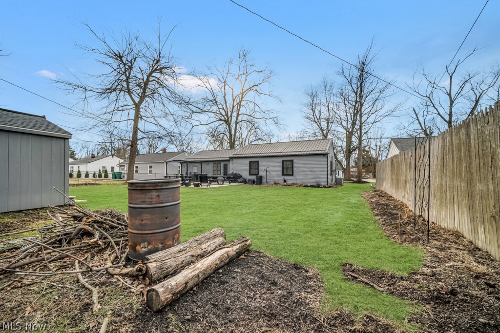 4875 Marigold Road Mentor, OH 44060 - Photo 23 of 27 Rear view of property featuring a patio area and a metal roof