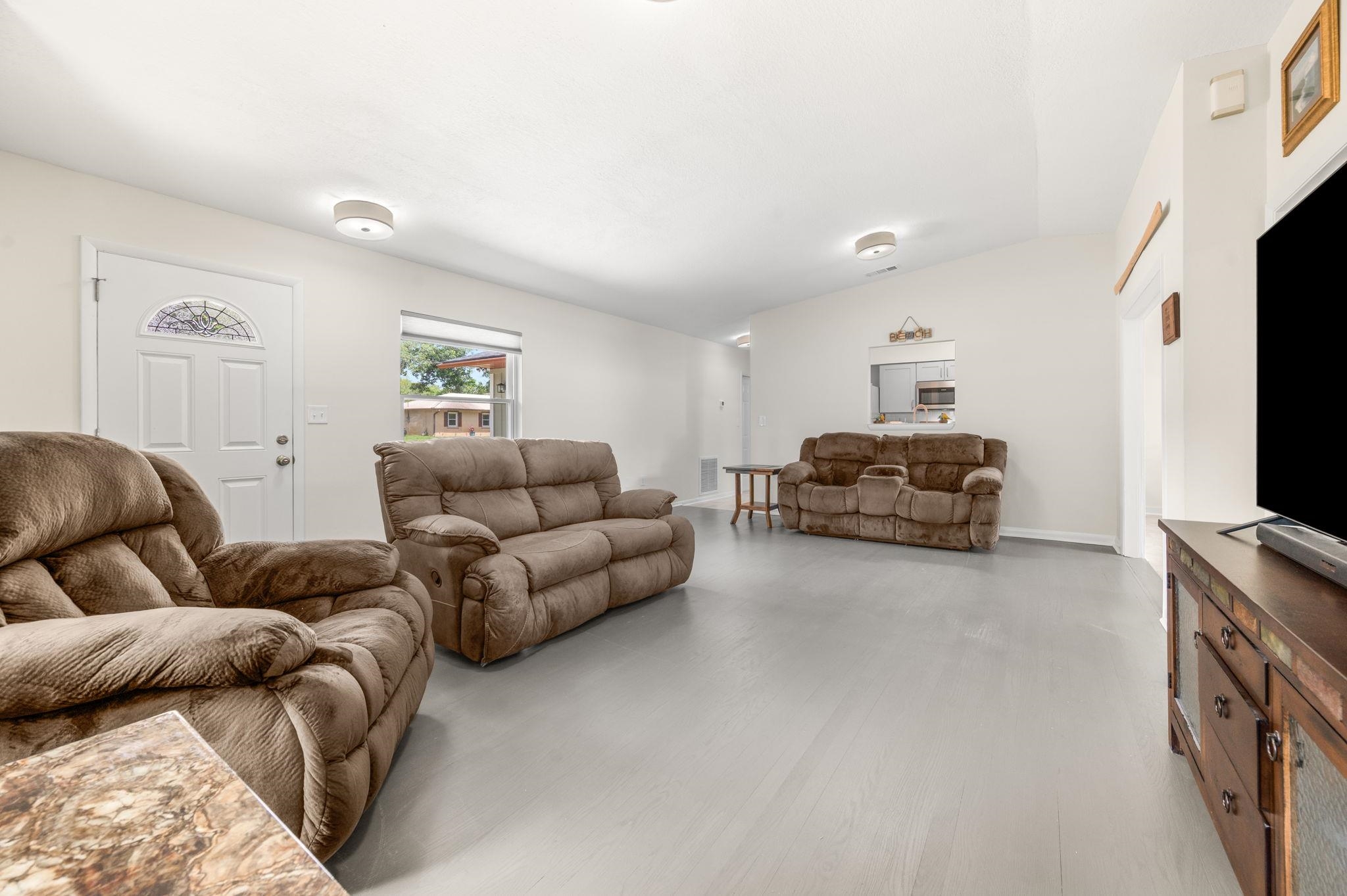 507 Gentian Road St. Augustine, FL 32086 - Photo 5 of 82 a living room with furniture and a flat screen tv