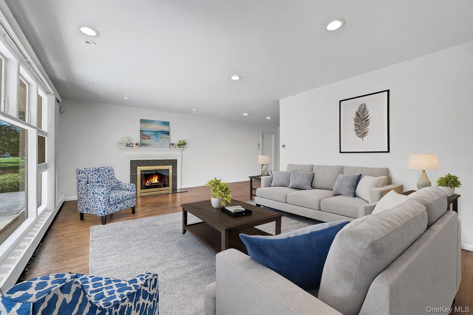 Fireplace adds warmth to living room - Virtually staged