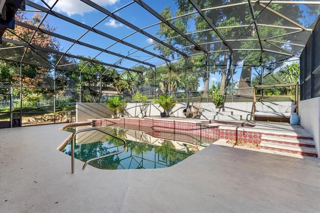 a view of a swimming pool with a patio
