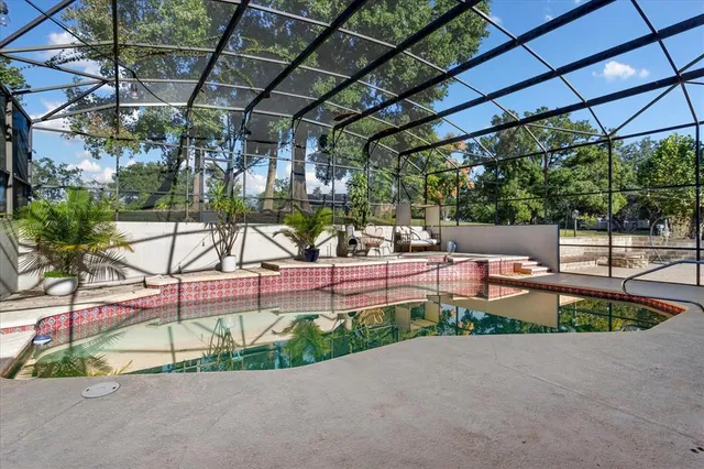a view of yard with a table and chairs