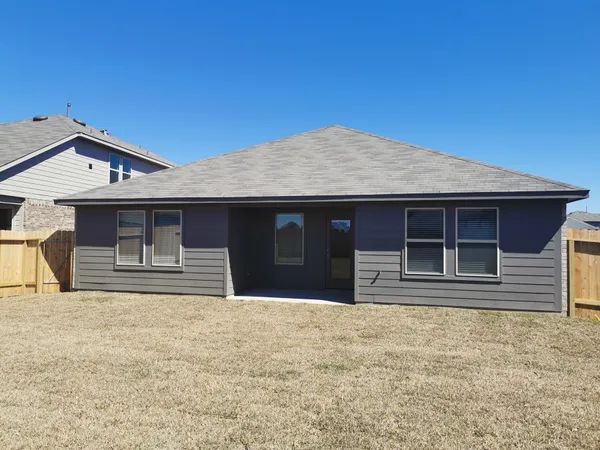 a house with trees in the background