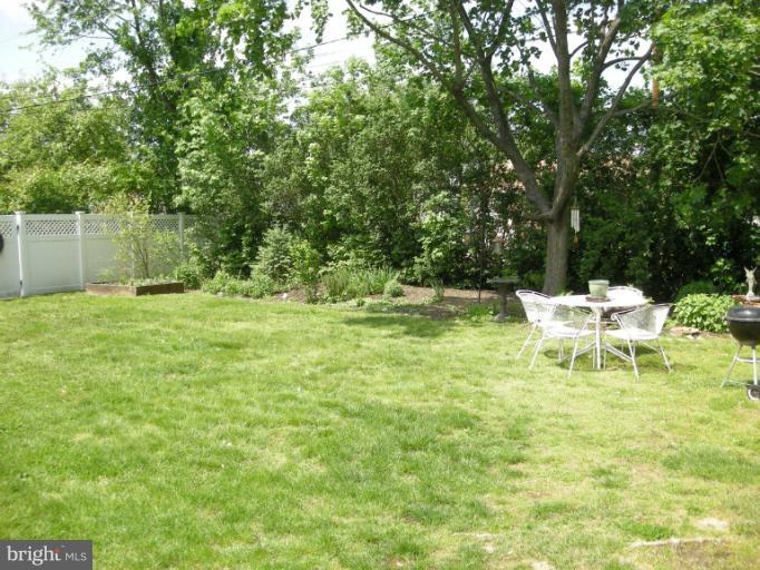1824 Hanson Road Edgewood, MD 21040 - Photo 14 of 18 a white bench sitting in a grassy field
