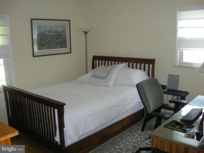 1824 Hanson Road Edgewood, MD 21040 - Photo 17 of 18 a bedroom with a bed and chair