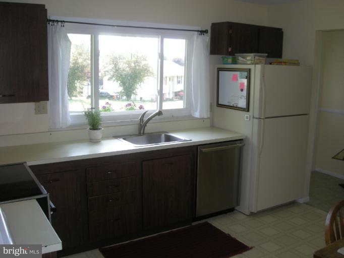 1824 Hanson Road Edgewood, MD 21040 - Photo 3 of 18 a kitchen with a sink cabinets and a refrigerator