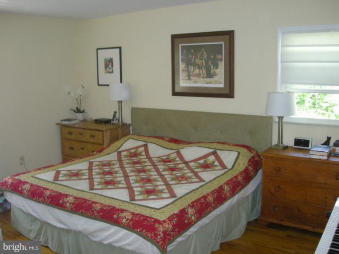 1824 Hanson Road Edgewood, MD 21040 - Photo 7 of 18 a bed sitting in a bedroom next to a window