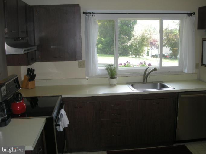 1824 Hanson Road Edgewood, MD 21040 - Photo 9 of 18 a kitchen with a sink a window and cabinets