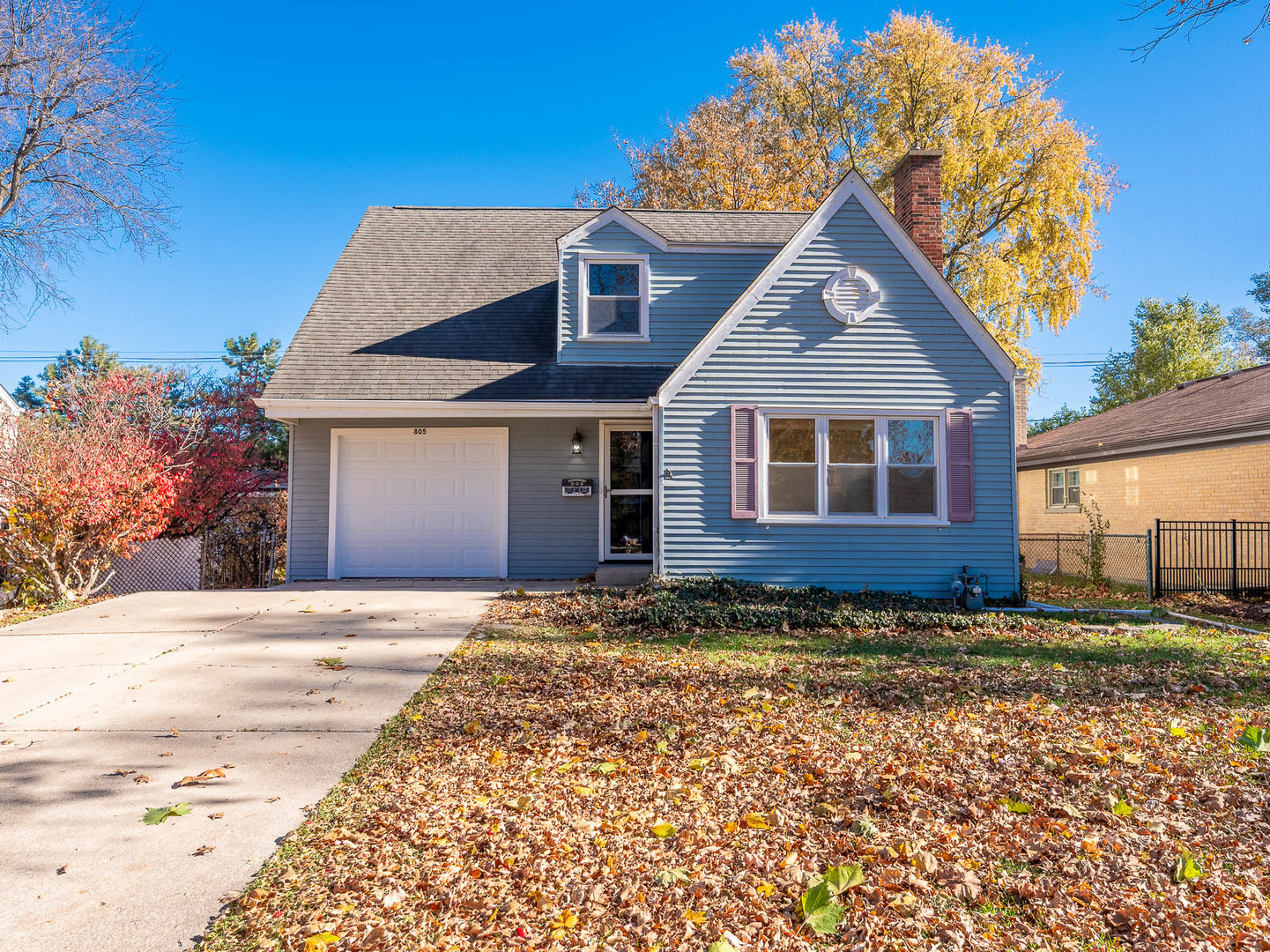 805 Spring Road Elmhurst, IL 60126 - Photo 1 of 16 a front view of a house with a yard
