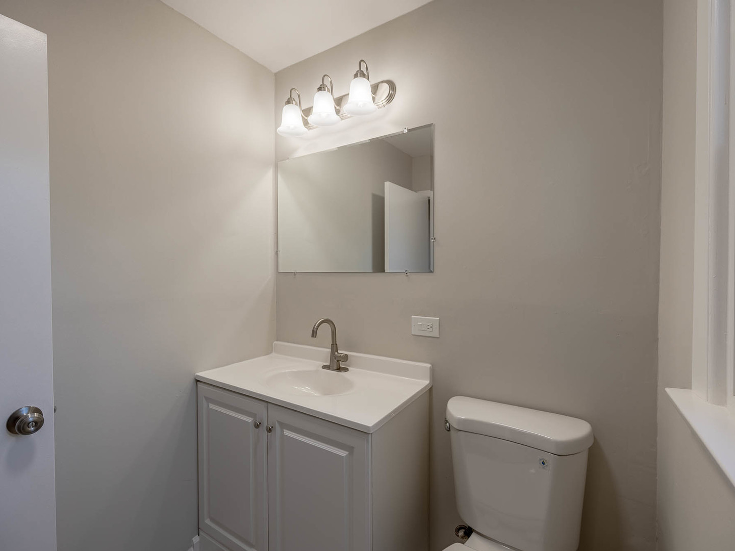 805 Spring Road Elmhurst, IL 60126 - Photo 6 of 16 a bathroom with a sink and a mirror