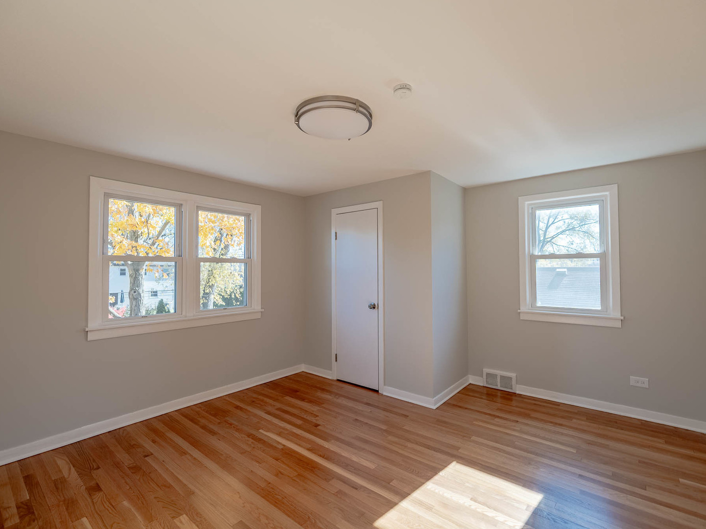 805 Spring Road Elmhurst, IL 60126 - Photo 7 of 16 a view of empty room with wooden floor and fan