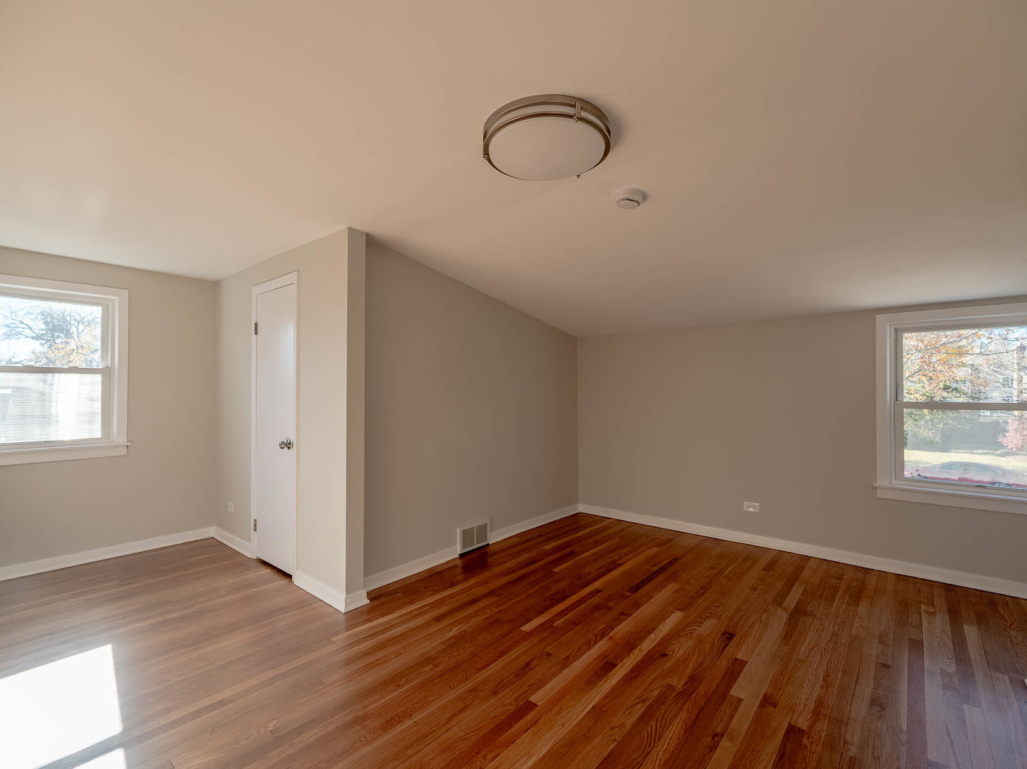 805 Spring Road Elmhurst, IL 60126 - Photo 9 of 16 an empty room with wooden floor and windows