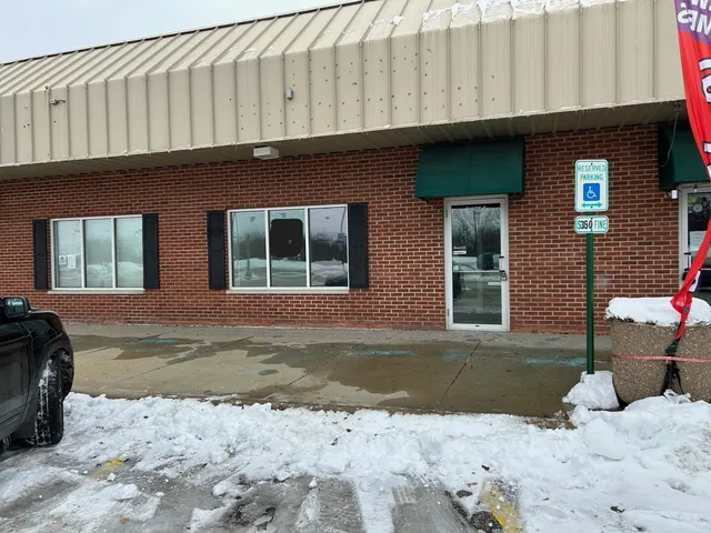 a front view of a building with outdoor space