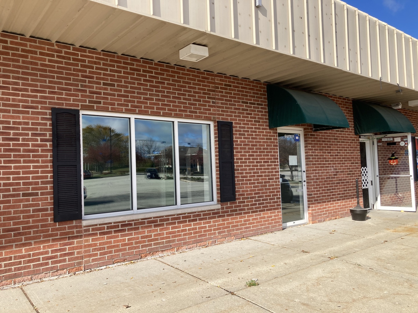 311 Depot Street, Unit F Antioch, IL 60002 - Photo 12 of 12 a view of a brick house with large windows