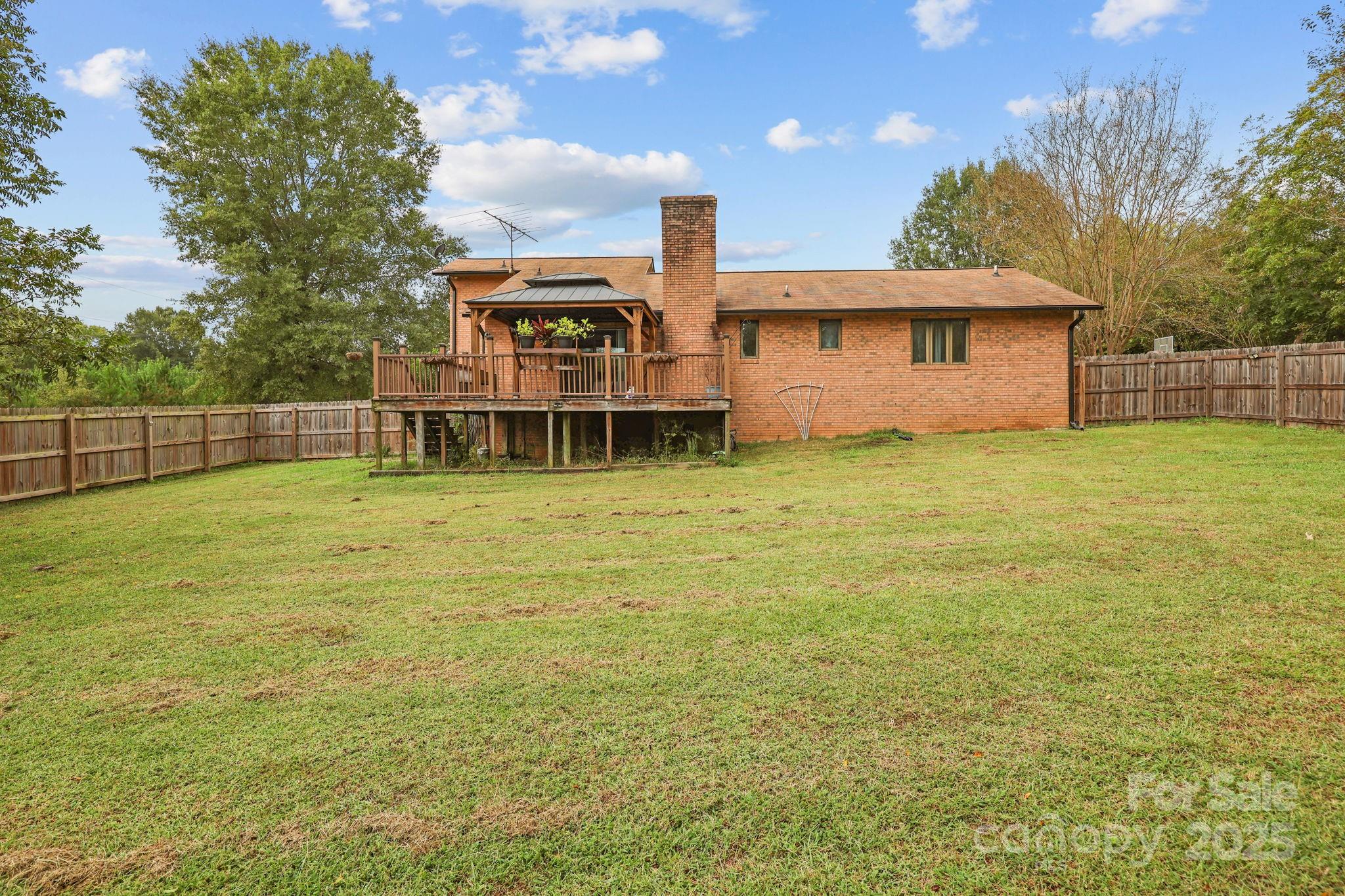 1765 Liberty Road Gold Hill, NC 28071 - Photo 11 of 41 a view of a house with a backyard