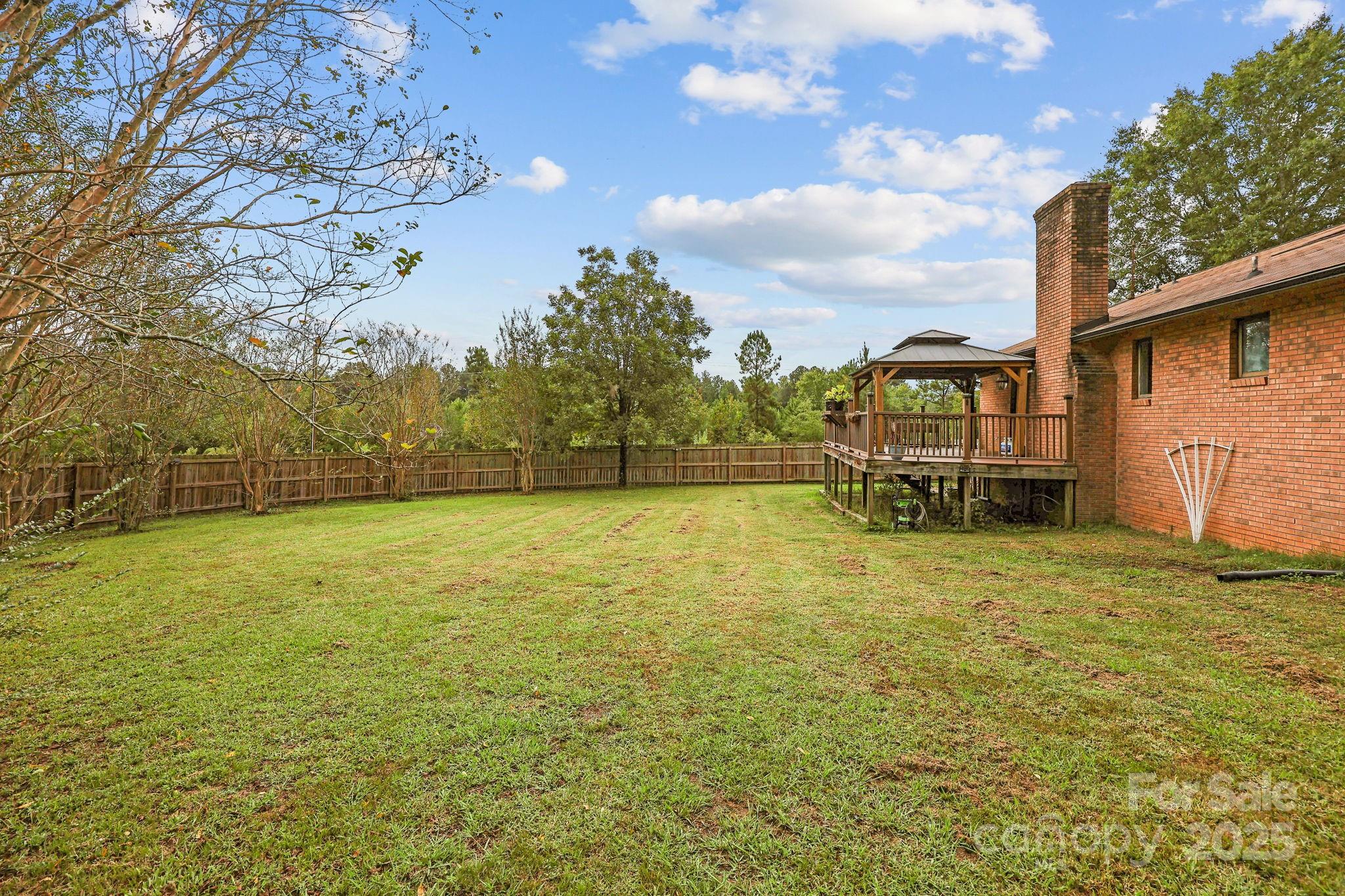 1765 Liberty Road Gold Hill, NC 28071 - Photo 12 of 41 a front view of a house with a yard