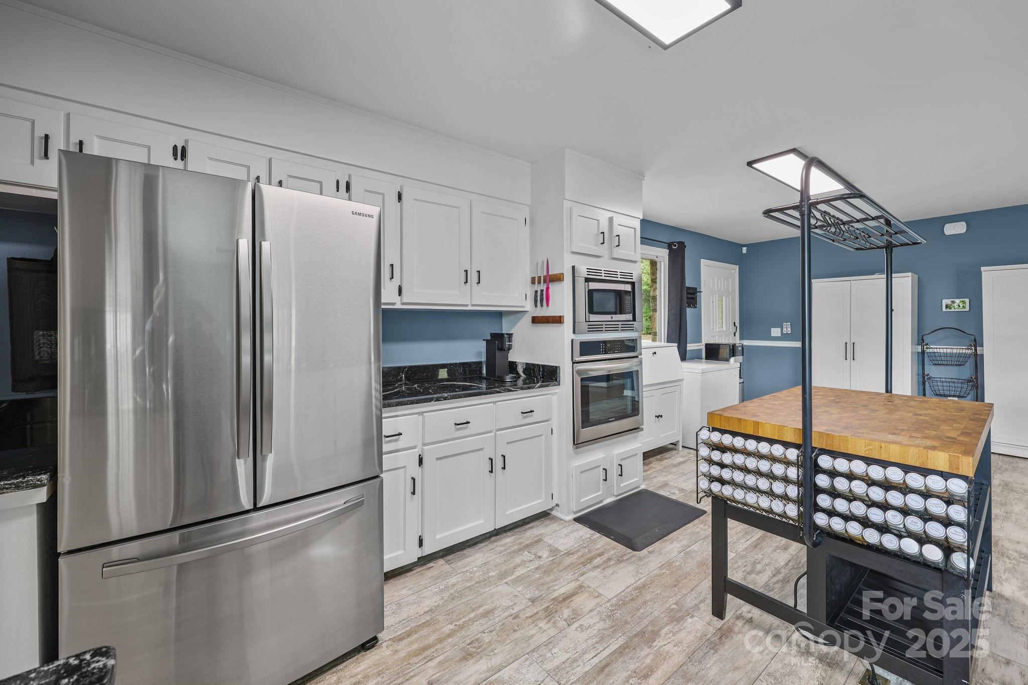 1765 Liberty Road Gold Hill, NC 28071 - Photo 14 of 41 a kitchen with stainless steel appliances granite countertop a refrigerator and a stove top oven