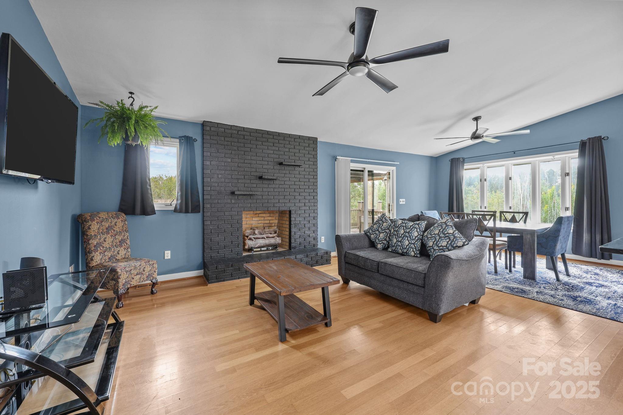 1765 Liberty Road Gold Hill, NC 28071 - Photo 15 of 41 a living room with furniture and a flat screen tv