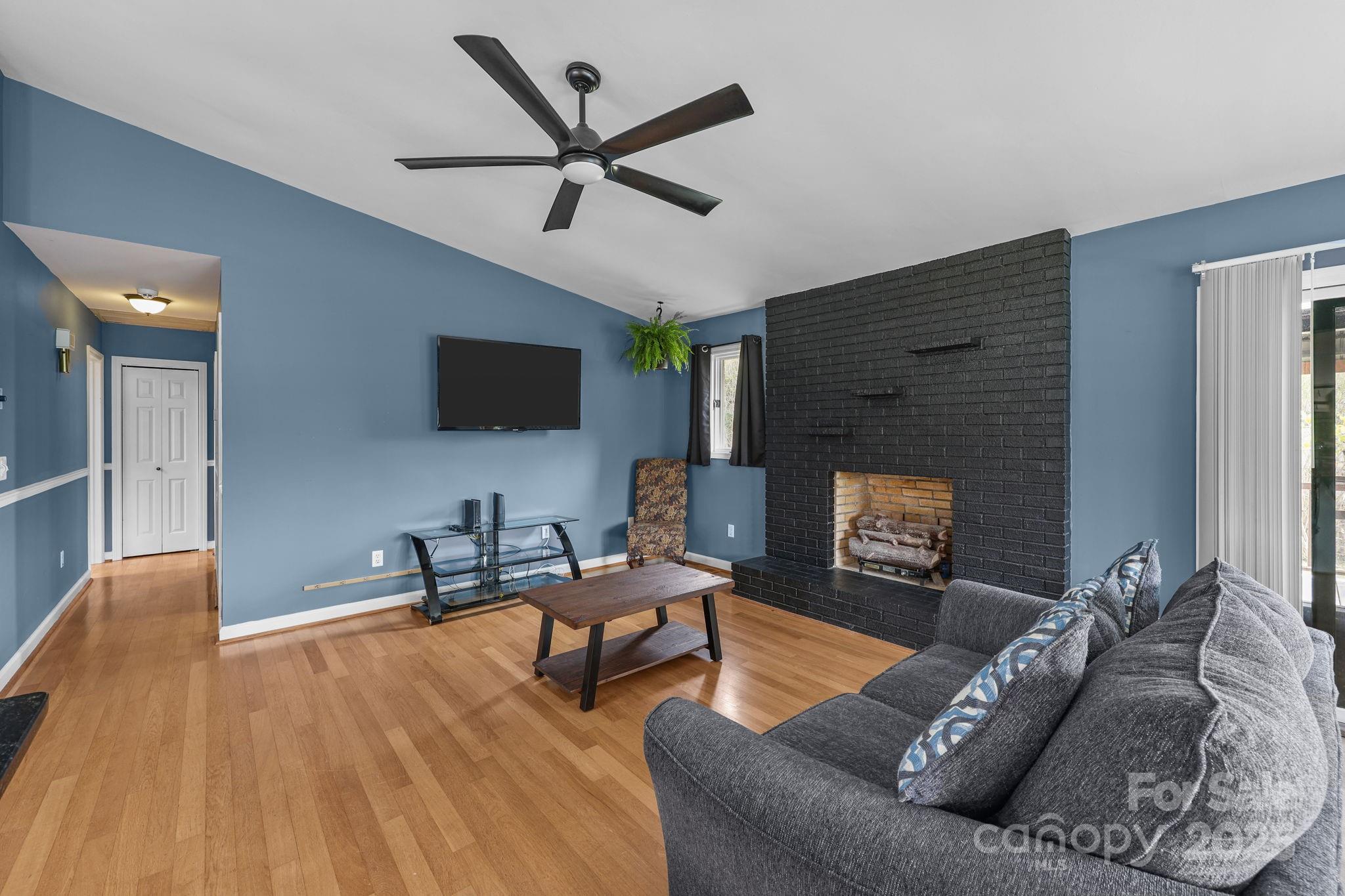 1765 Liberty Road Gold Hill, NC 28071 - Photo 16 of 41 a living room with furniture and a flat screen tv