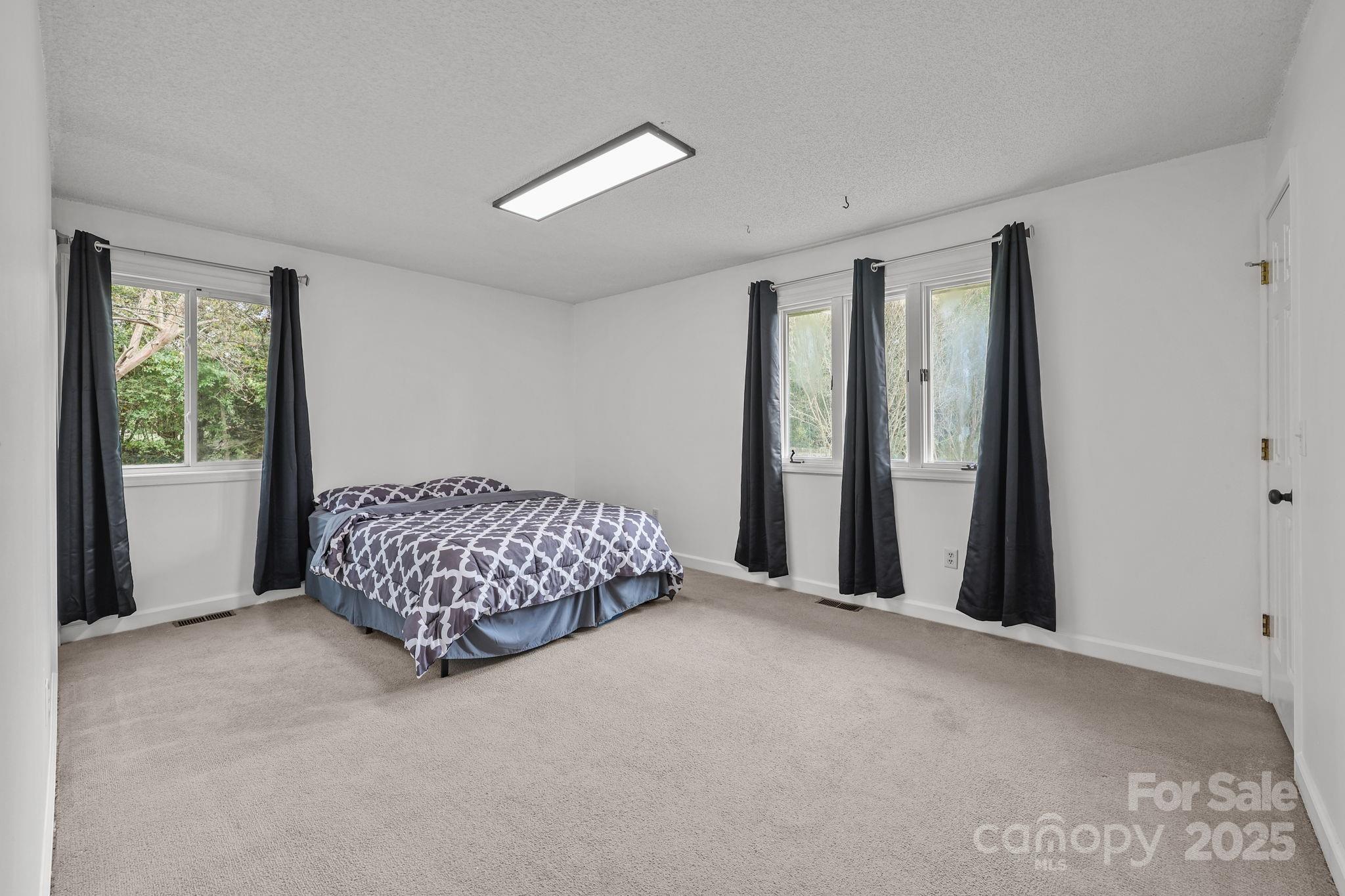 1765 Liberty Road Gold Hill, NC 28071 - Photo 18 of 41 a bedroom with a bed and a window