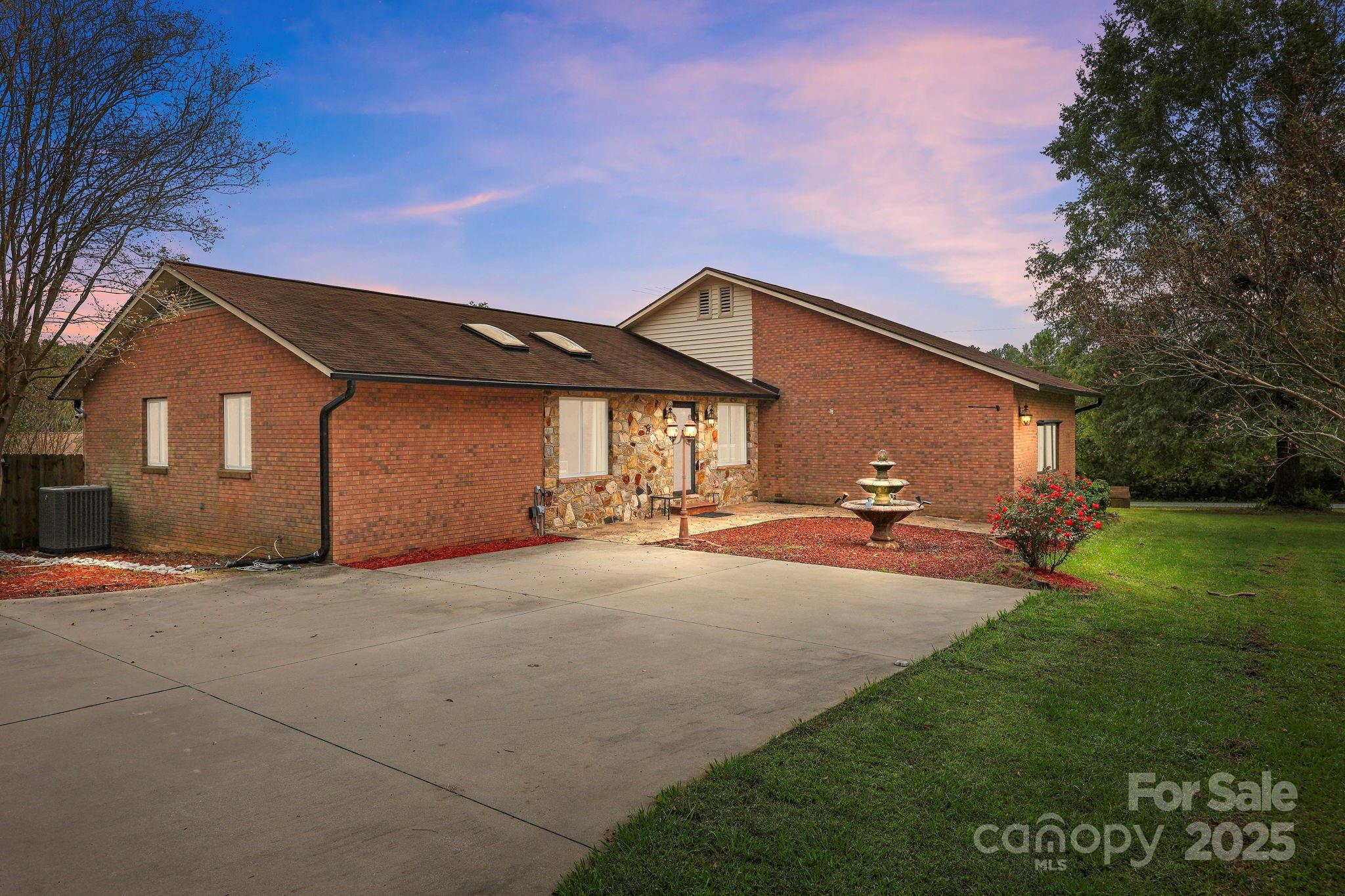 1765 Liberty Road Gold Hill, NC 28071 - Photo 2 of 41 a view of a house with backyard and garden