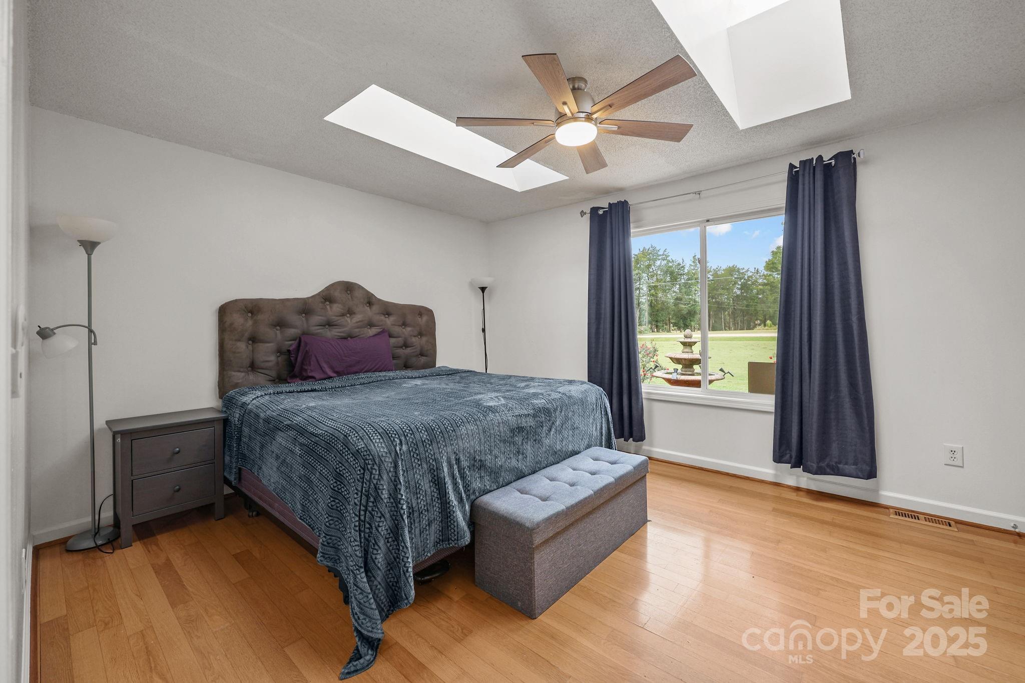 1765 Liberty Road Gold Hill, NC 28071 - Photo 22 of 41 a bedroom with a bed couch and window