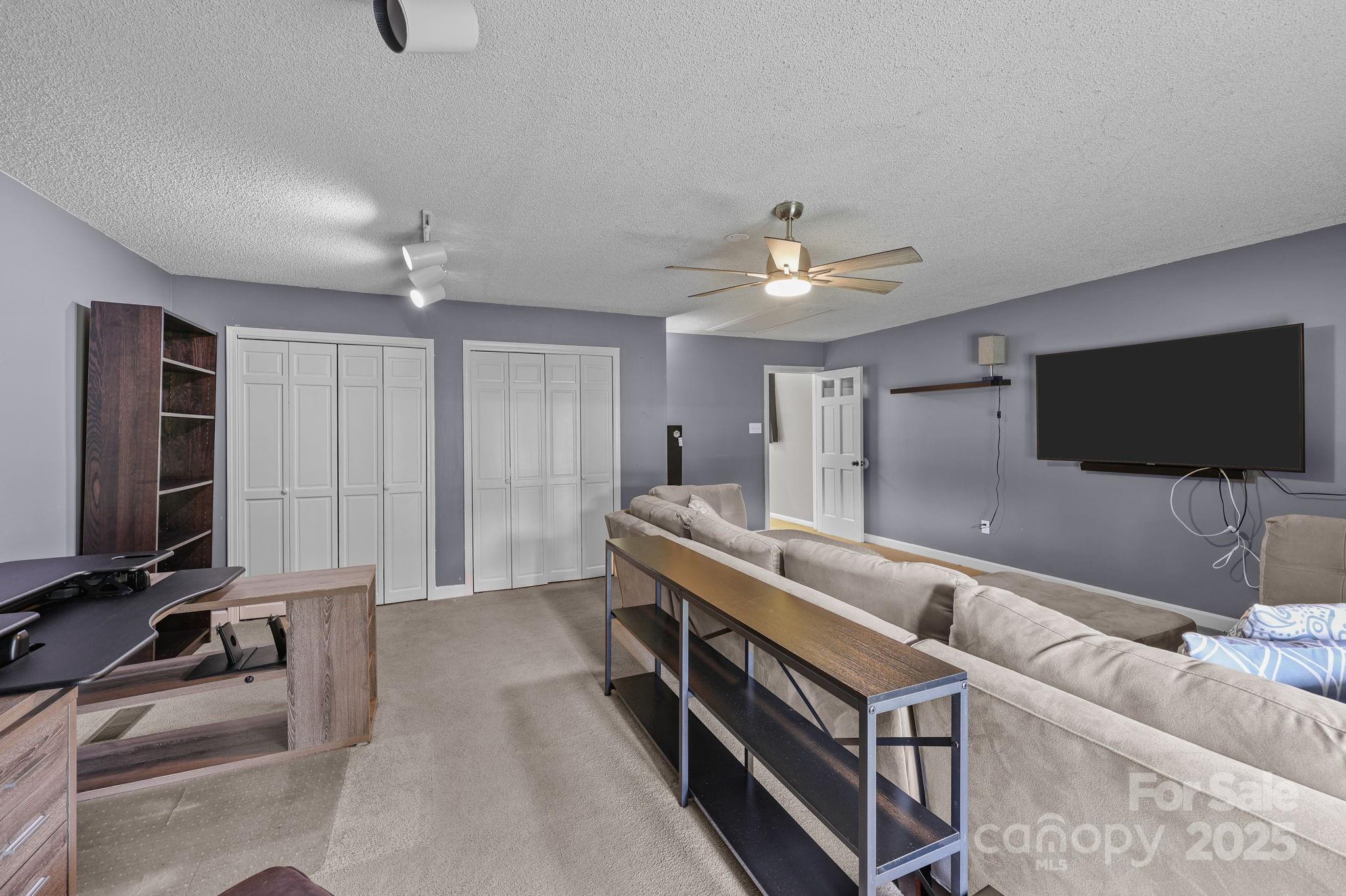 1765 Liberty Road Gold Hill, NC 28071 - Photo 29 of 41 a living room with furniture and a flat screen tv