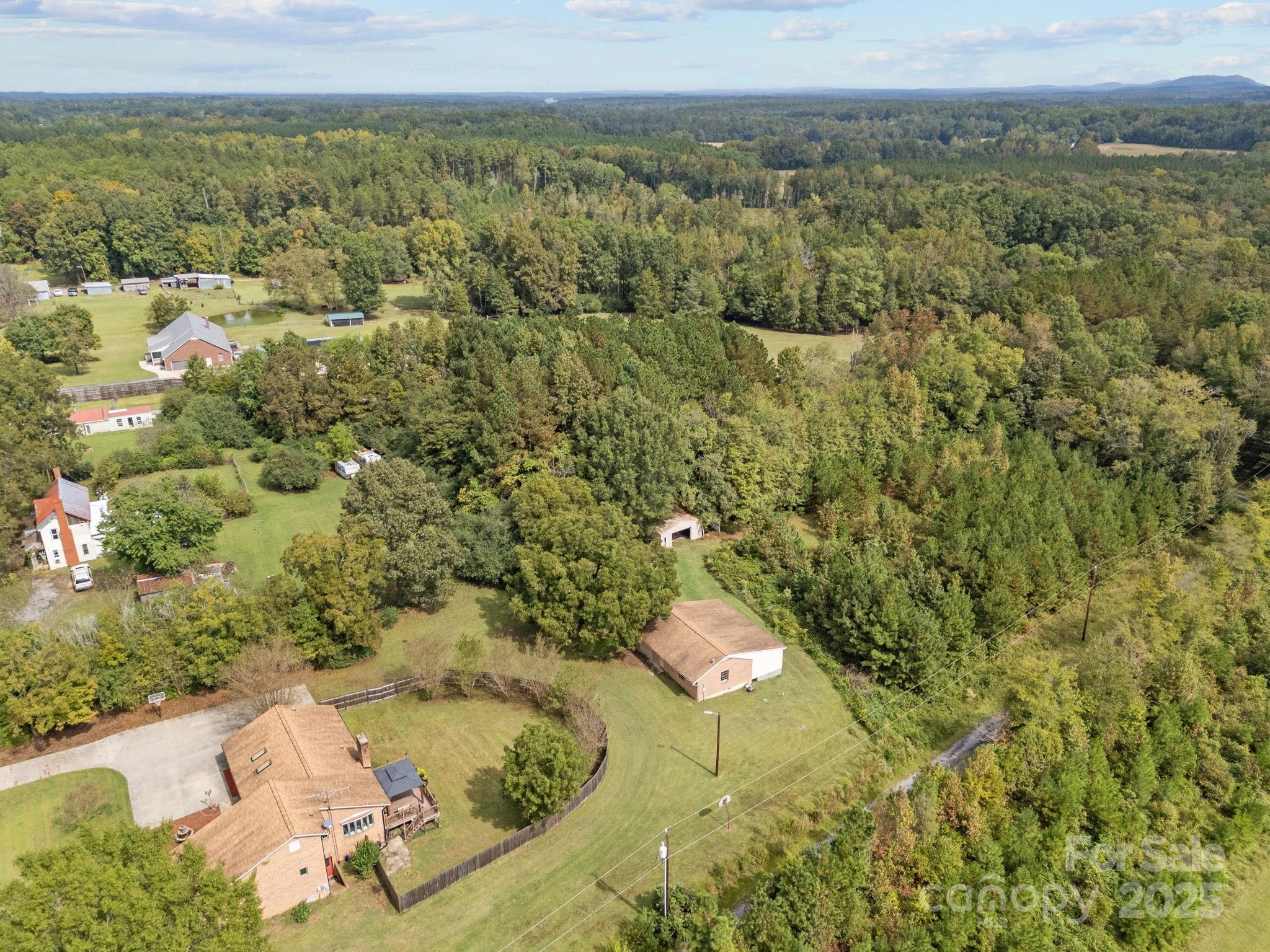 1765 Liberty Road Gold Hill, NC 28071 - Photo 33 of 41 an aerial view of a house with a yard