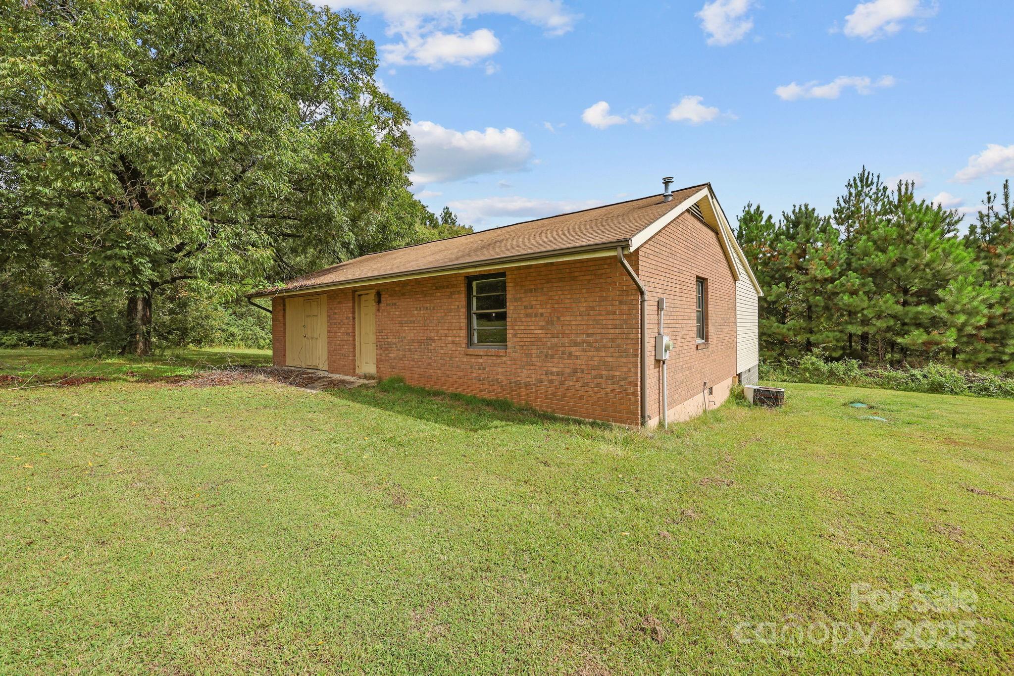 1765 Liberty Road Gold Hill, NC 28071 - Photo 34 of 41 a view of a backyard with large trees