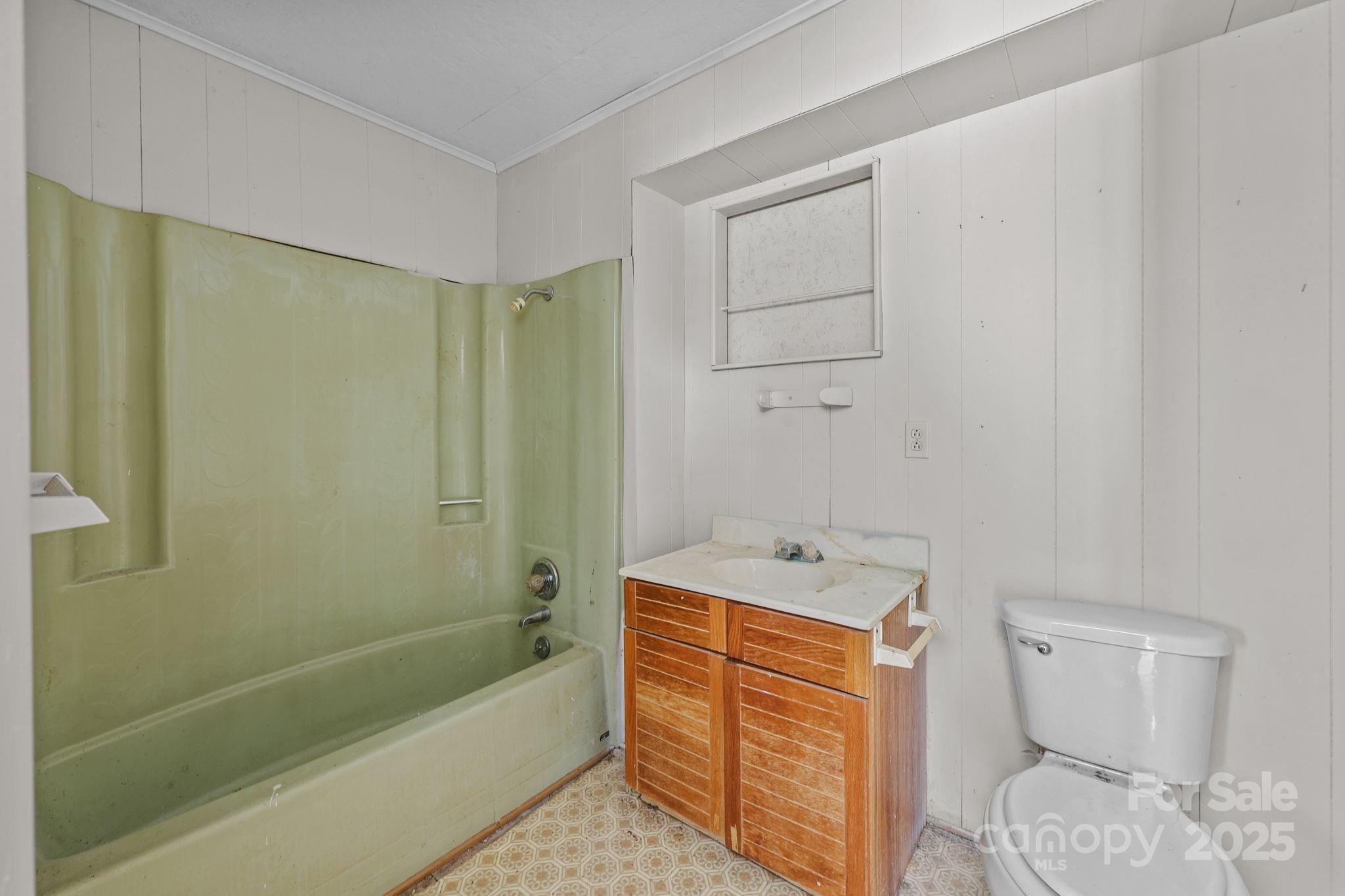 1765 Liberty Road Gold Hill, NC 28071 - Photo 36 of 41 a bathroom with a sink a toilet and shower