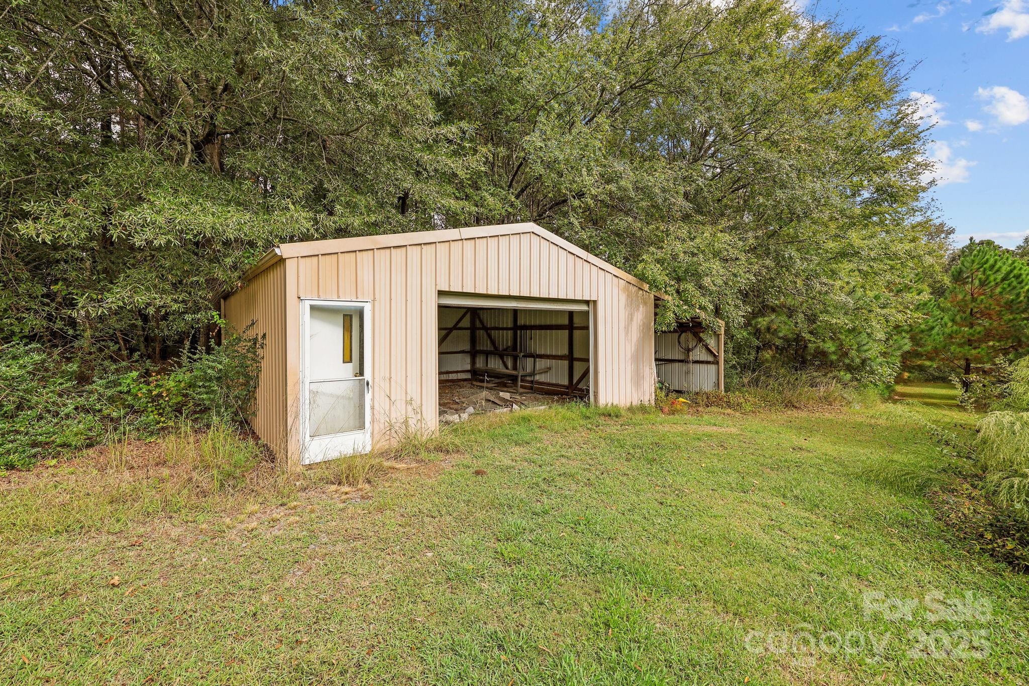 1765 Liberty Road Gold Hill, NC 28071 - Photo 40 of 41 a view of a house with backyard and garden