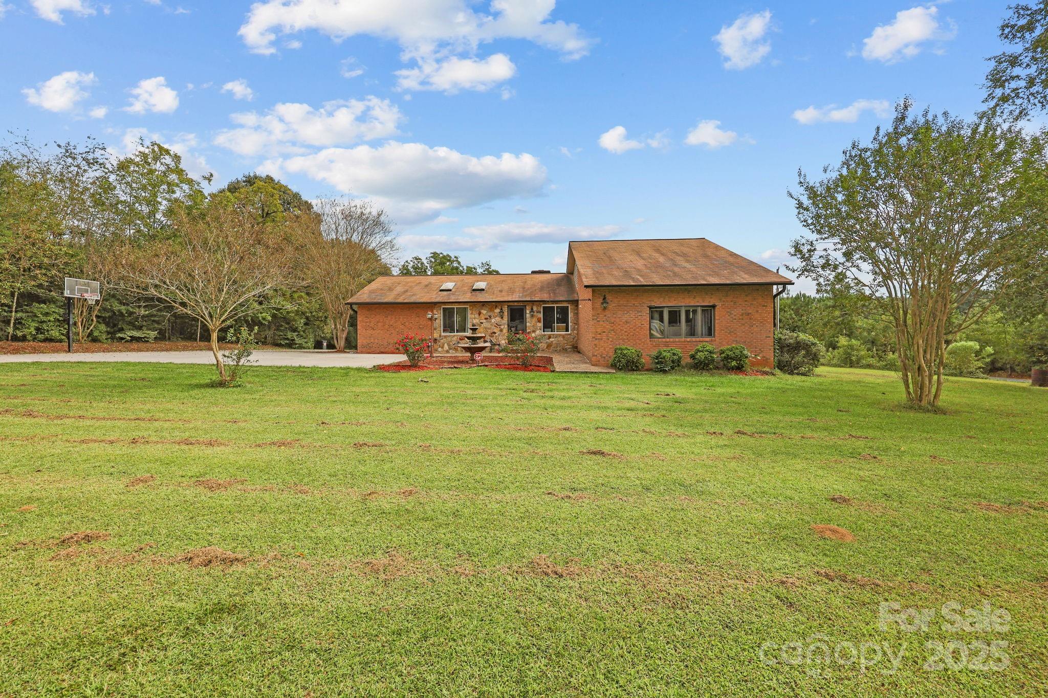 1765 Liberty Road Gold Hill, NC 28071 - Photo 41 of 41 a view of a house with a big yard