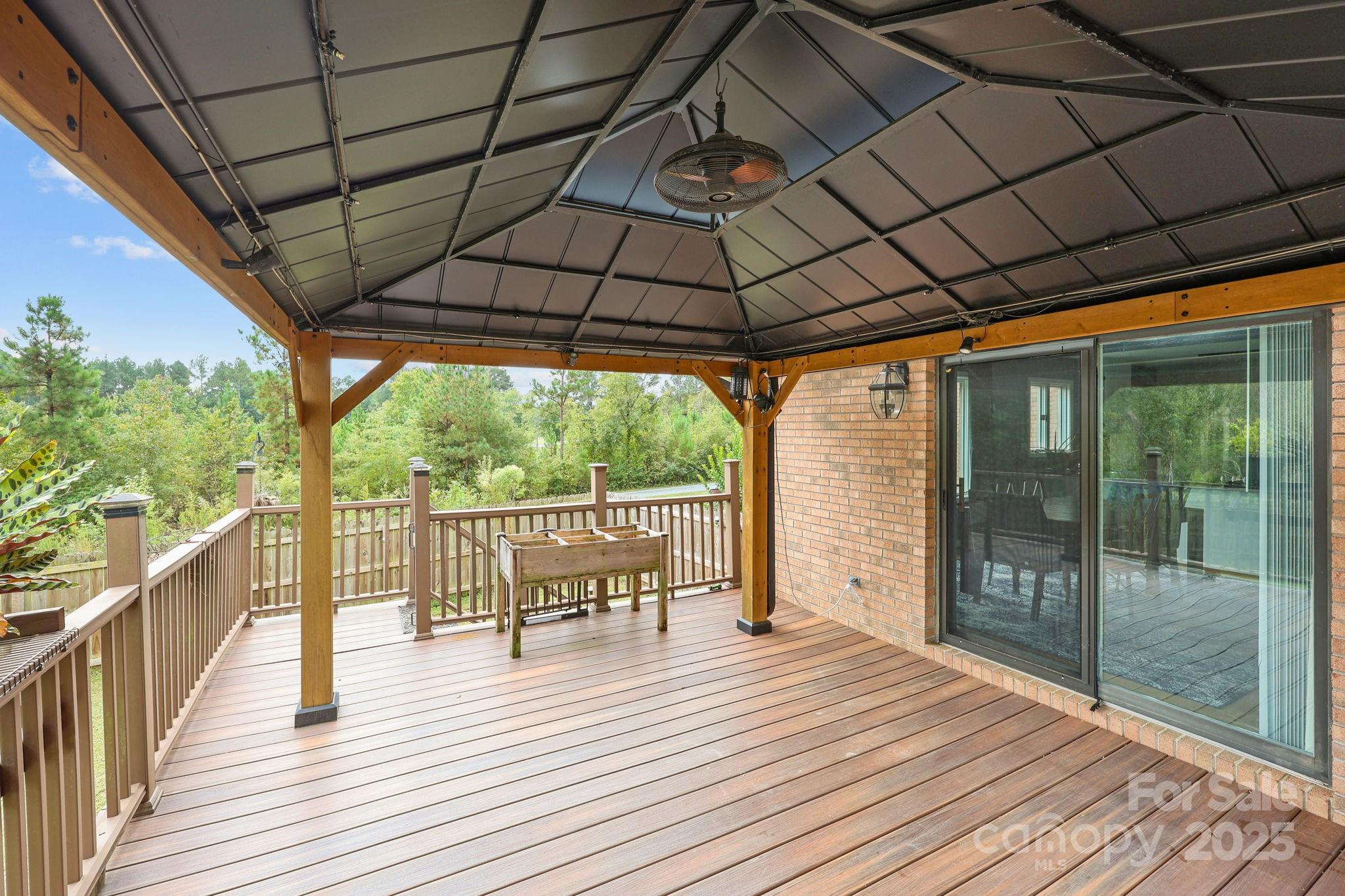 1765 Liberty Road Gold Hill, NC 28071 - Photo 9 of 41 a patio view with a seating space and hardwood floor