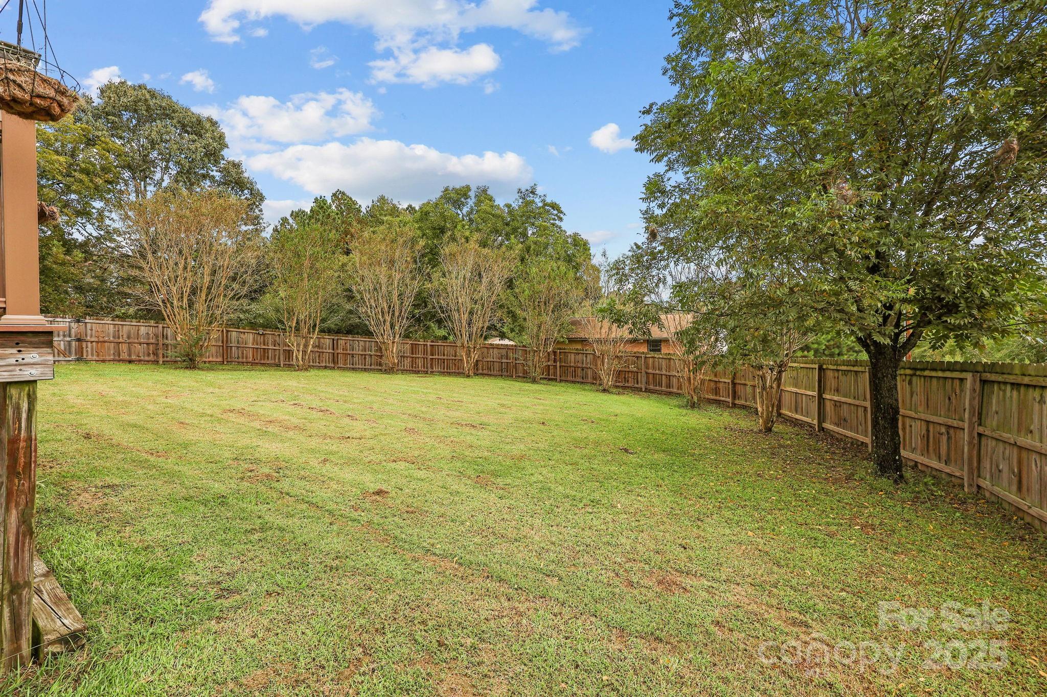 1765 Liberty Road Gold Hill, NC 28071 - Photo 10 of 41 a view of yard with tree and a wooden fence