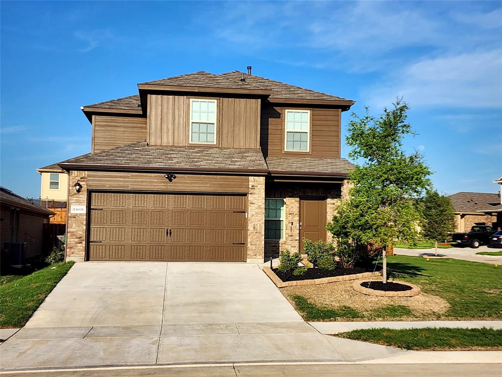 3469 Mildren Bend Crandall, TX 75114 - Photo 1 of 1 a front view of a house with garage