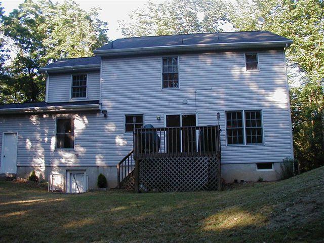 2203 Brislin Road Stroudsburg, PA 18360 - Photo 3 of 11 a front view of a house with a yard
