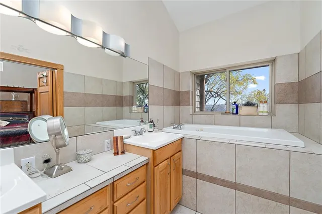 a kitchen with a sink cabinets and appliances
