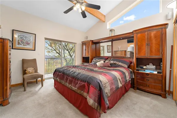 a bed room with a bed and a chair