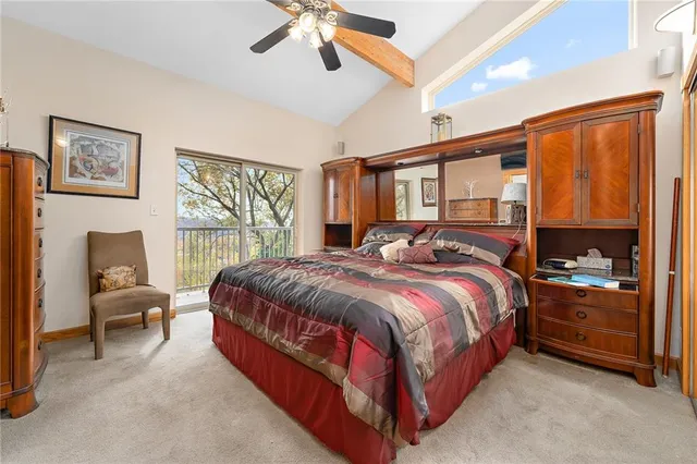 a bed room with a bed and a chair