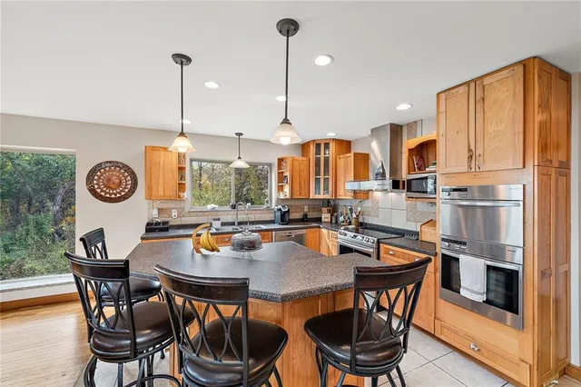 a kitchen with a table chairs and a stove
