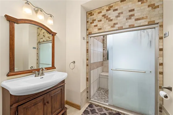 a bathroom with a sink and a mirror