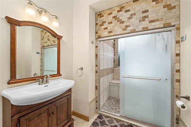 a bathroom with a sink and a mirror