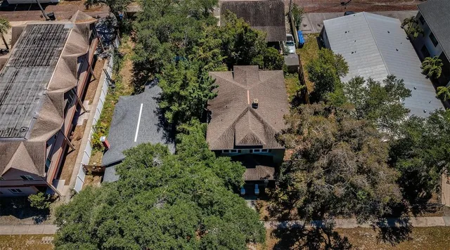 an aerial view of a house with outdoor space