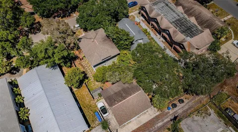 an aerial view of house with yard