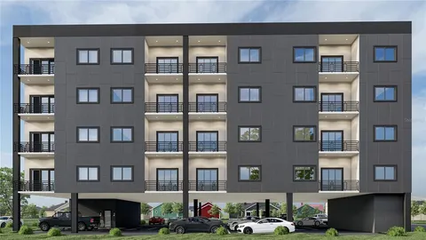 a front view of a building with many windows