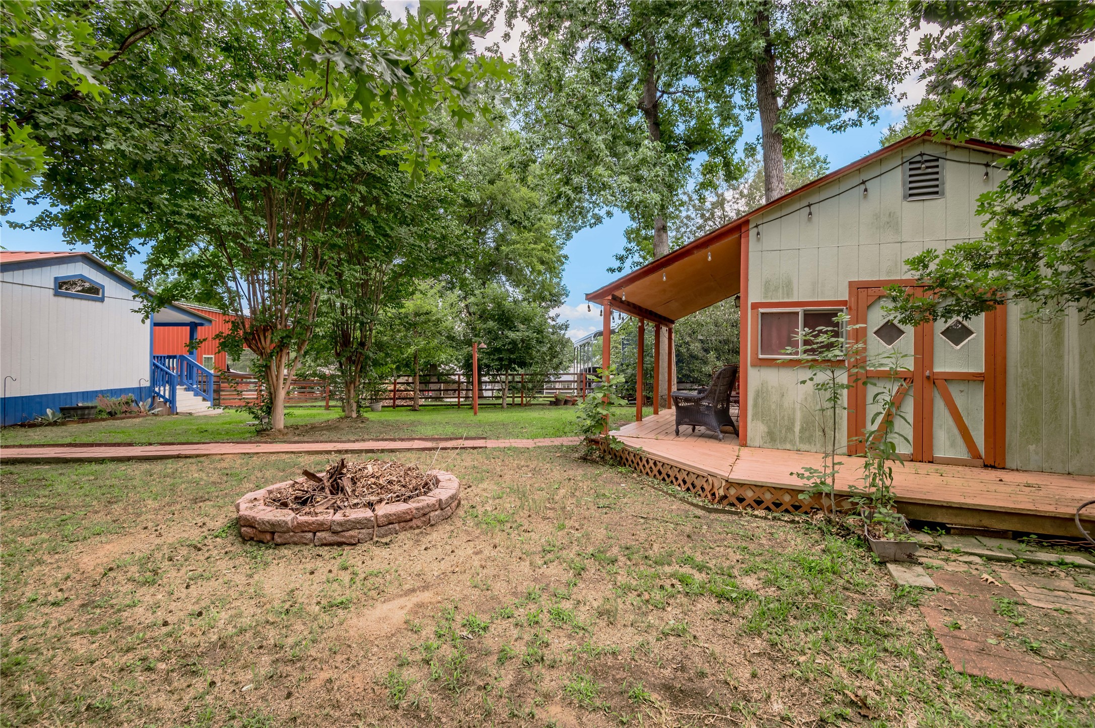 21 Oahu Court Point Blank, TX 77364 - Photo 32 of 45 Side yard of guest house with firepit