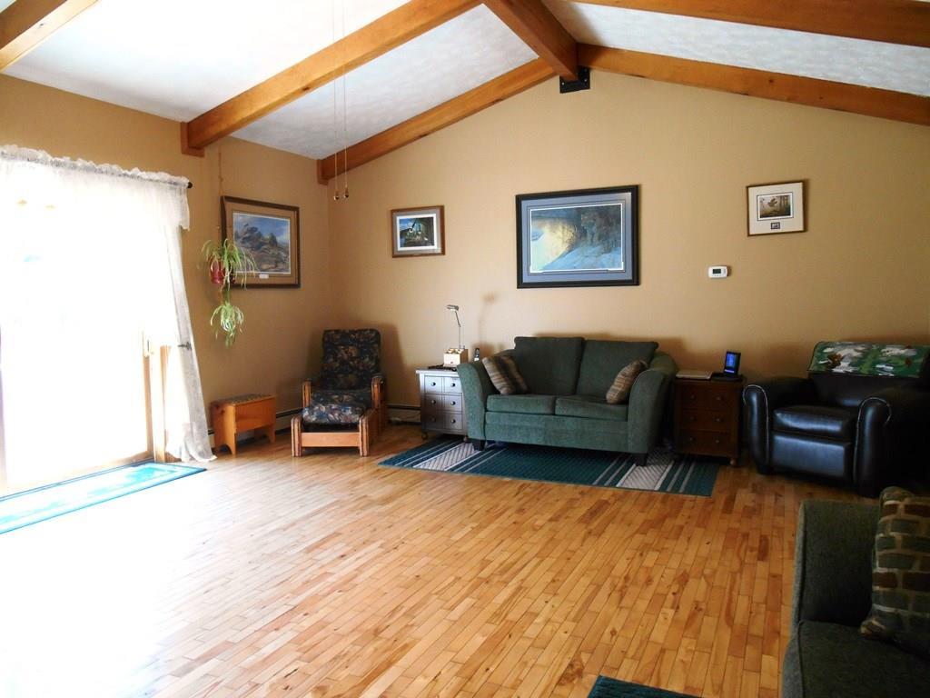 1356 Stratton Road Rangeley, ME 04970 - Photo 6 of 35 Large sunlit step-down family room...
