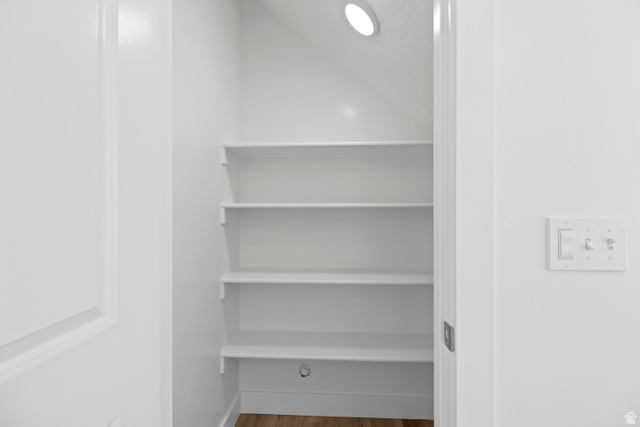 1271 West 500 South Logan, UT 84321 - Photo 9 of 26 Interior pantry with five white shelves, recessed ceiling lighting, and wood-finish flooring