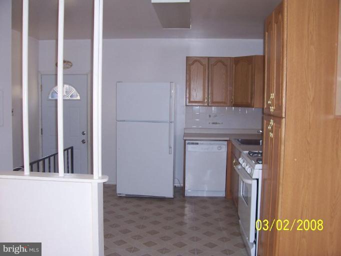 3747 Trent Road Randallstown, MD 21133 - Photo 3 of 9 a view of kitchen with granite countertop cabinets and refrigerator