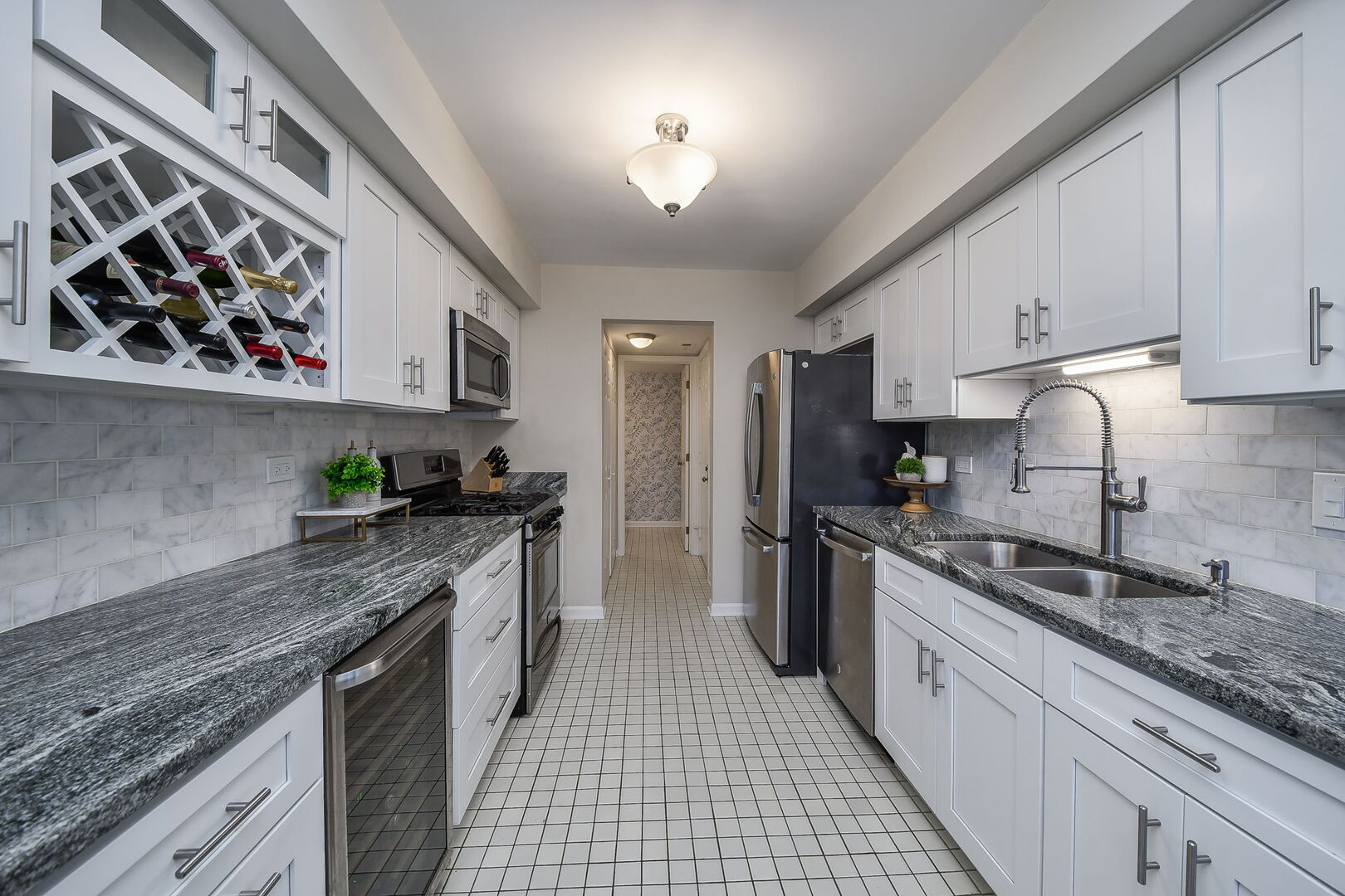 1941 Gresham Circle Wheaton, IL 60189 - Photo 5 of 13 a large kitchen with stainless steel appliances granite countertop a stove a sink and a granite counter tops