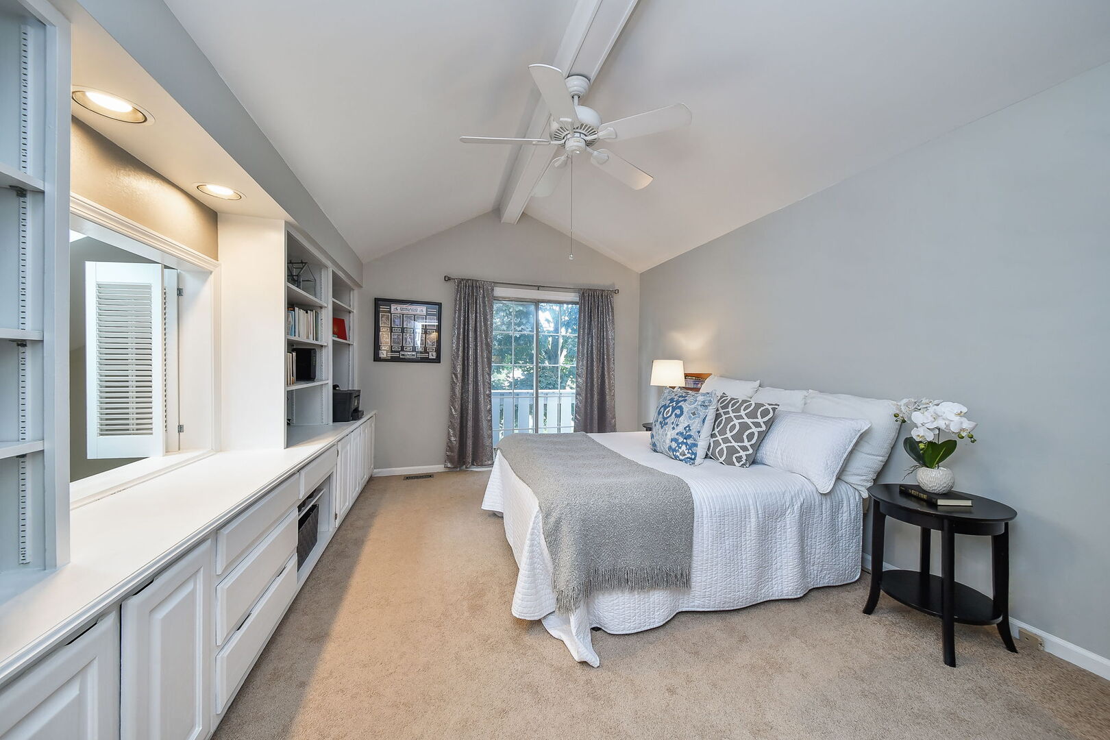 1941 Gresham Circle Wheaton, IL 60189 - Photo 8 of 13 a spacious bedroom with a large bed and a chandelier